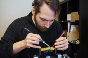 Alex Jones working on an Apiara bee hive scale component.
