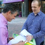 Tom MacMillan collects former Mayoral candidate Ethan Strimling's signature for the $15 minimum wage initiative.