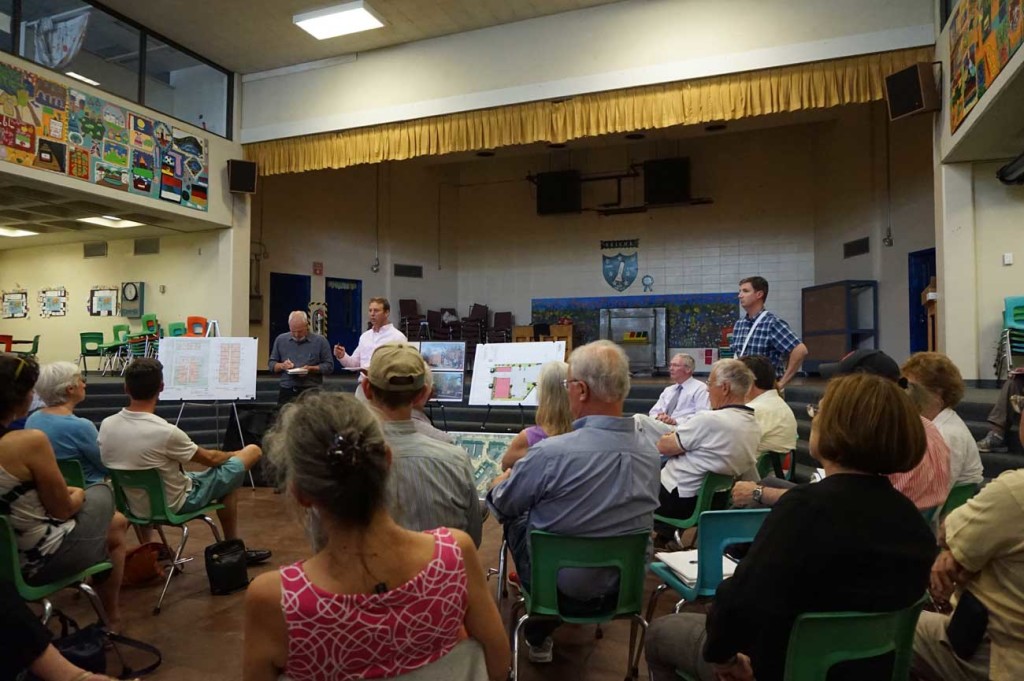 Avesta reps pitch their development to the neighborhood at Reiche Community School cafeteria.