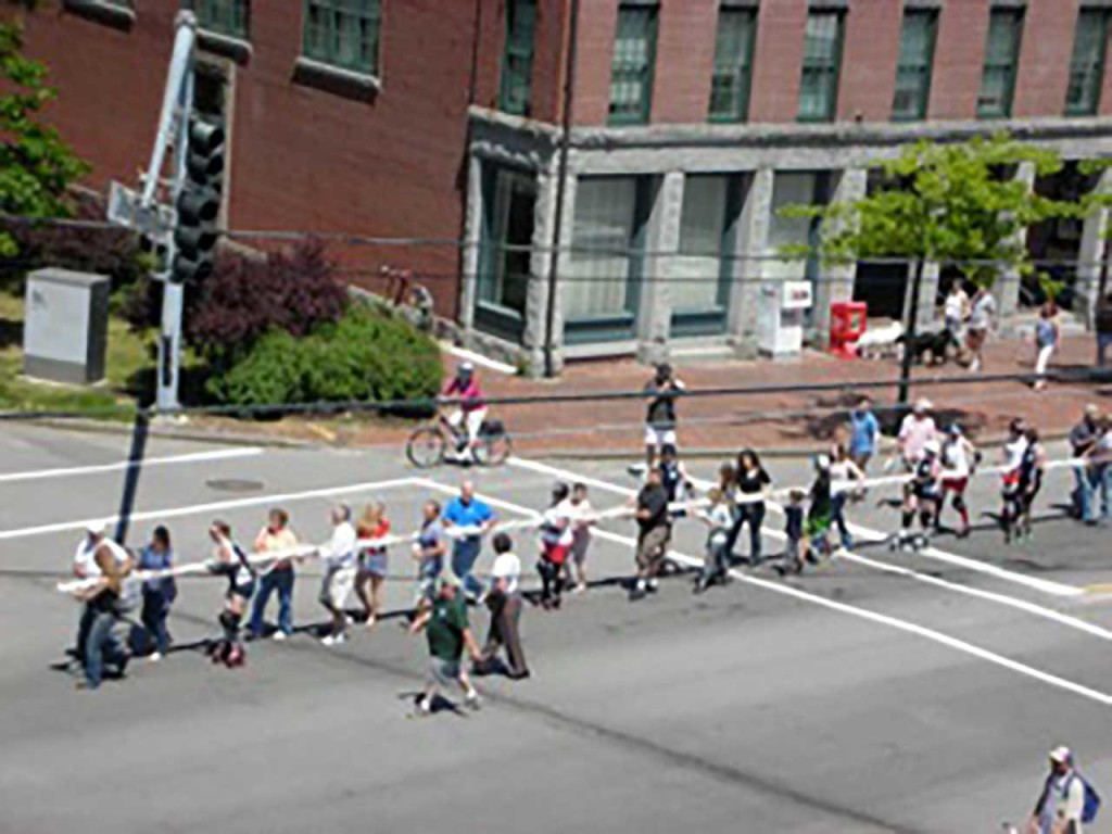 Old Port Festival 2009 - Arrival of World's Longest Lobster Roll with the Roller Derby skaters. -Photo by Steve Graef