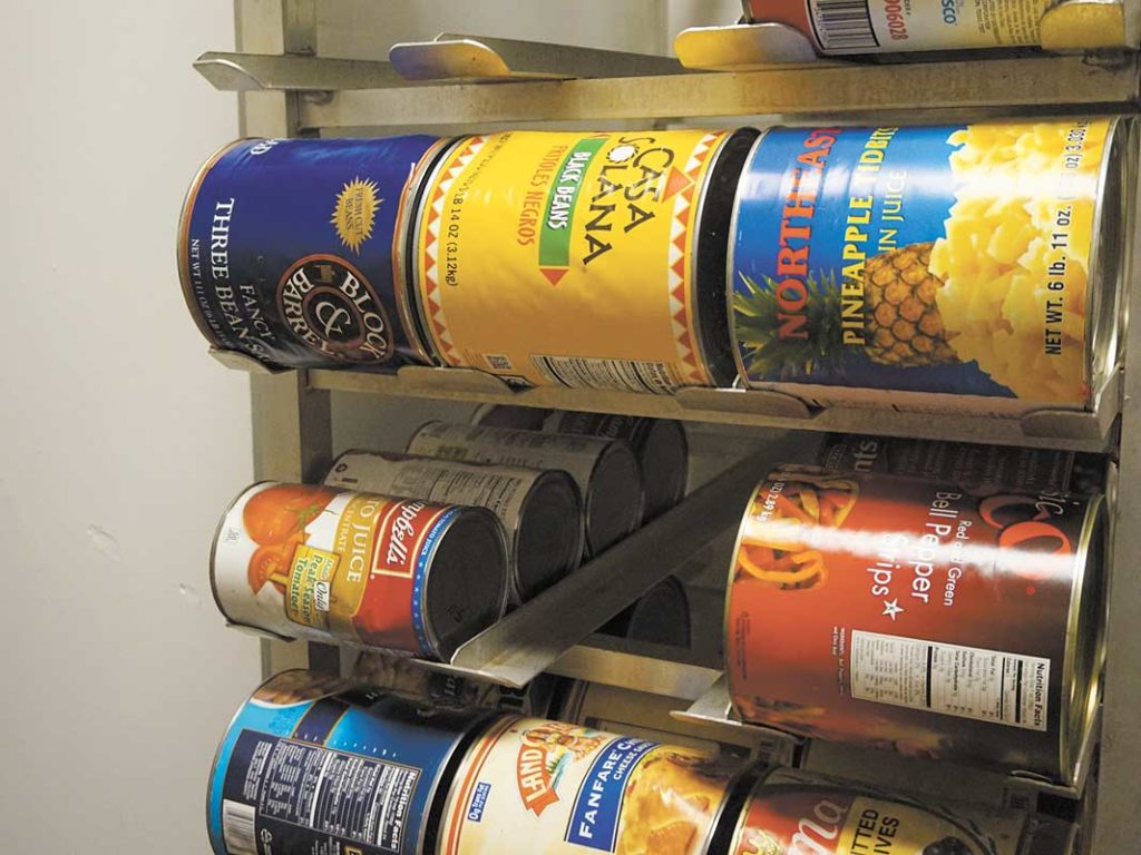 West End News - Giving Food _ cans stacked at Wayside