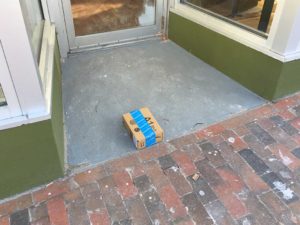West End News - Disappearing packages - Amazon box in doorway
