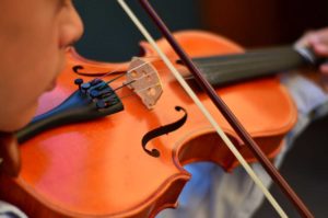 West End News - PCM - Child plays violin