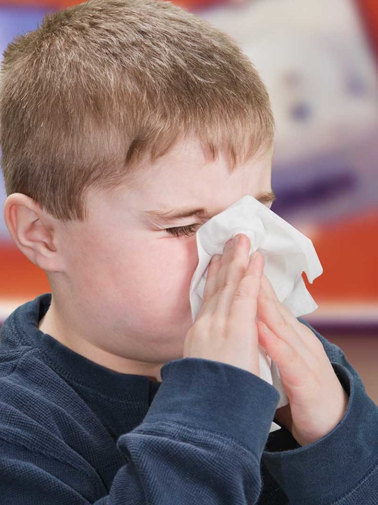 West End News - Flu Season Get Prepared - Child sneezing Adobe Stock