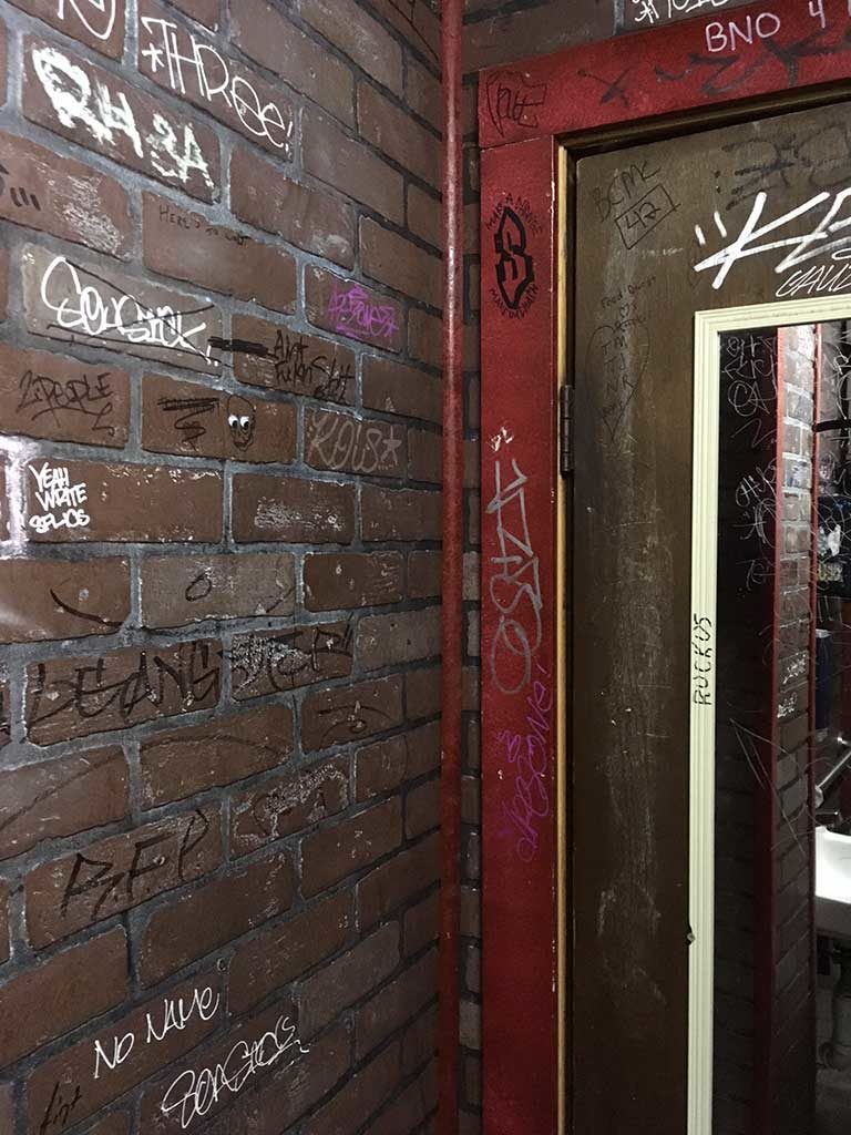 West End News - Ruski's Review - Bathroom graffitti