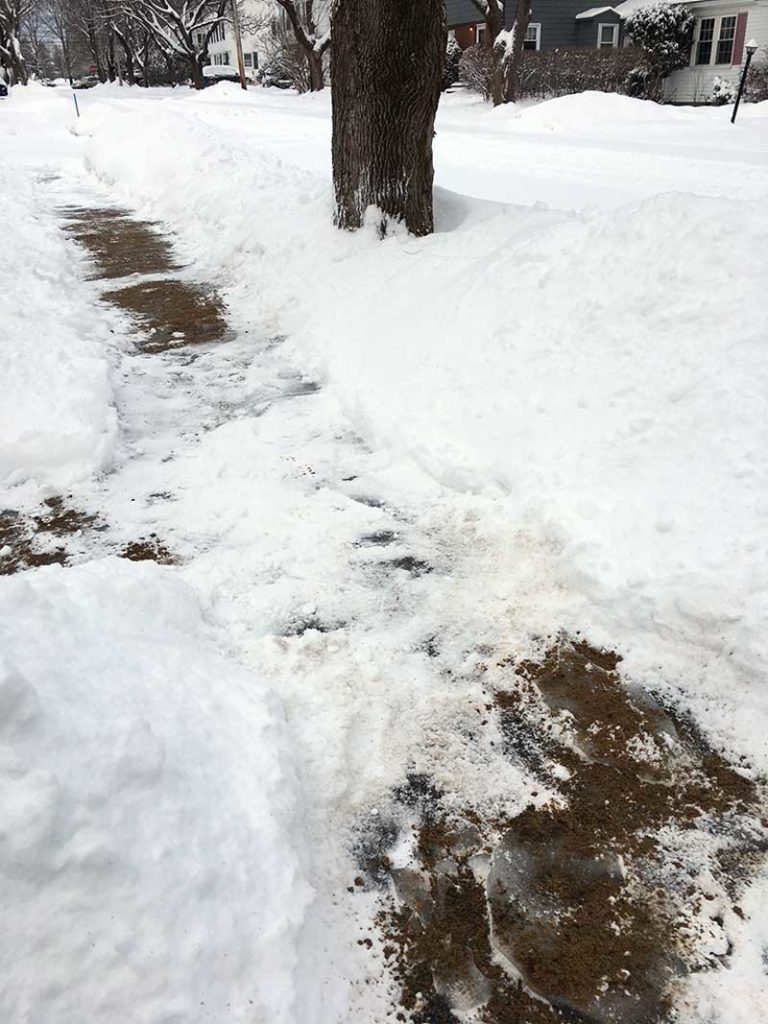 West End News - Snowy sidewalk after snow removal in Portland, Maine