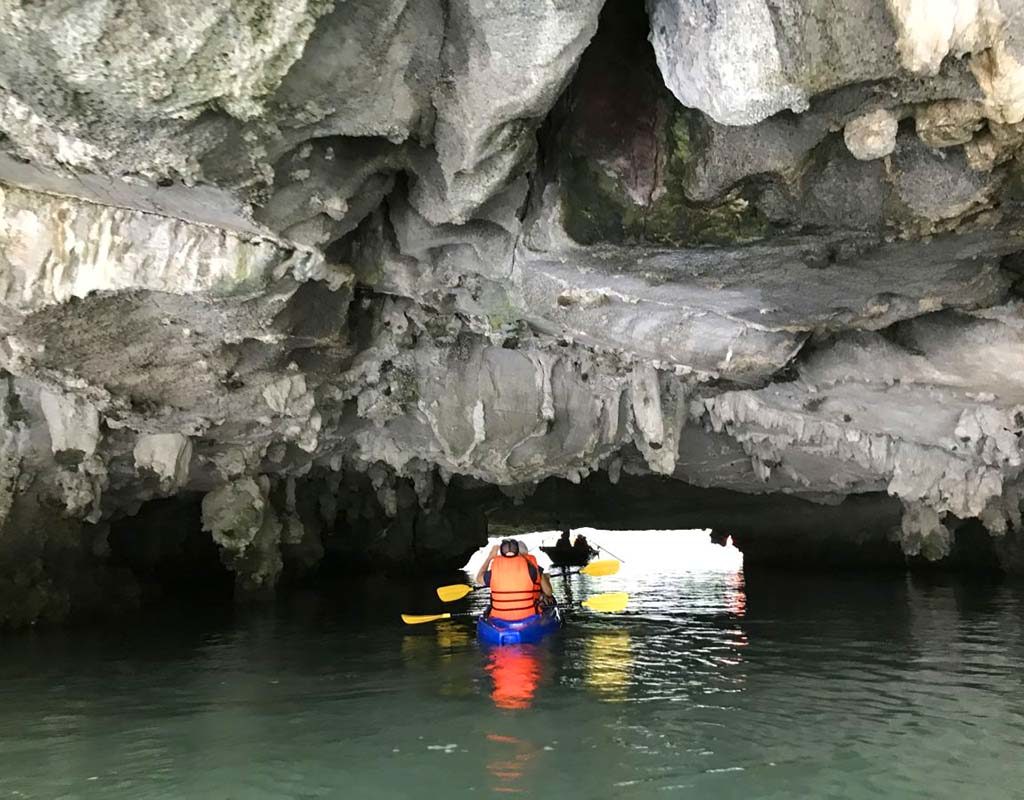 West End News - Kayaking among the caves of Halong Bay. - By Nancy Dorrans