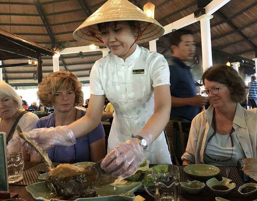 West End News - Nancy Dorrans samples elephant ear fish on thanksgiving in Vietnam