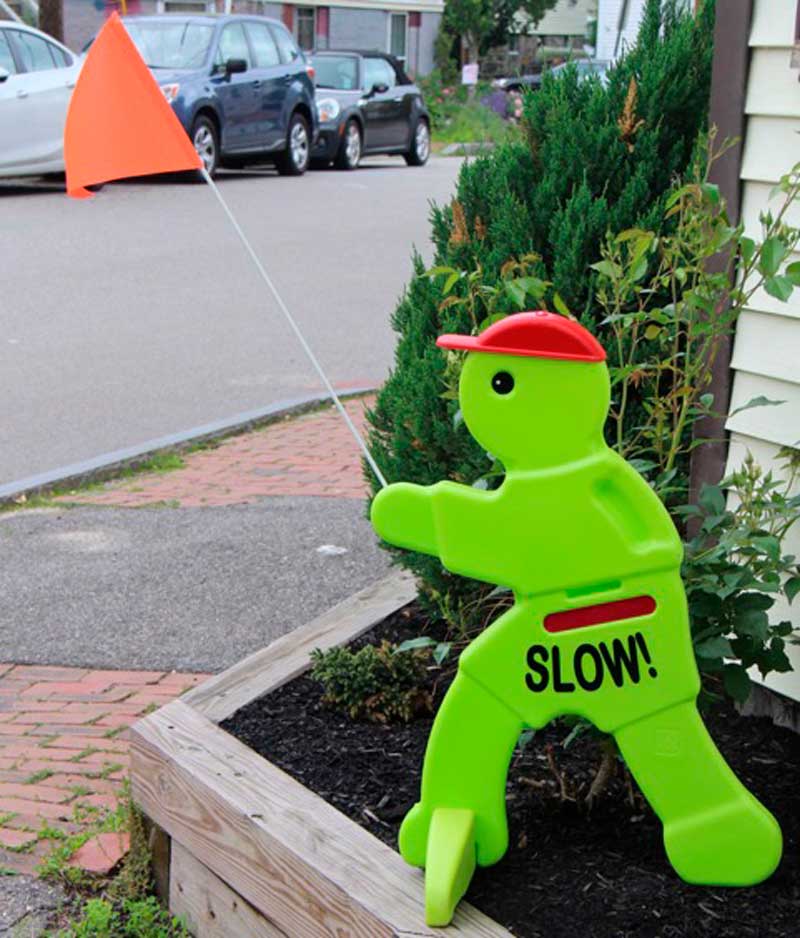 West End News - Slow Down Green Guy sign - Photo By Rosanne Graef
