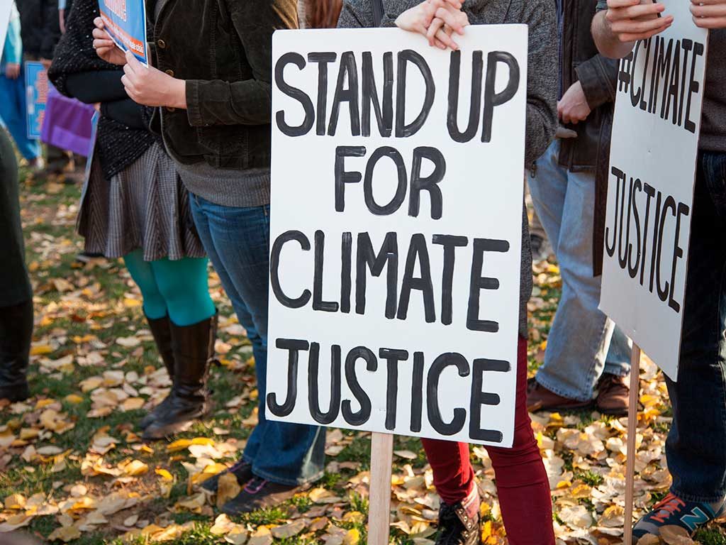 West End News - Climate Emergency - Stand up for climate justice sign