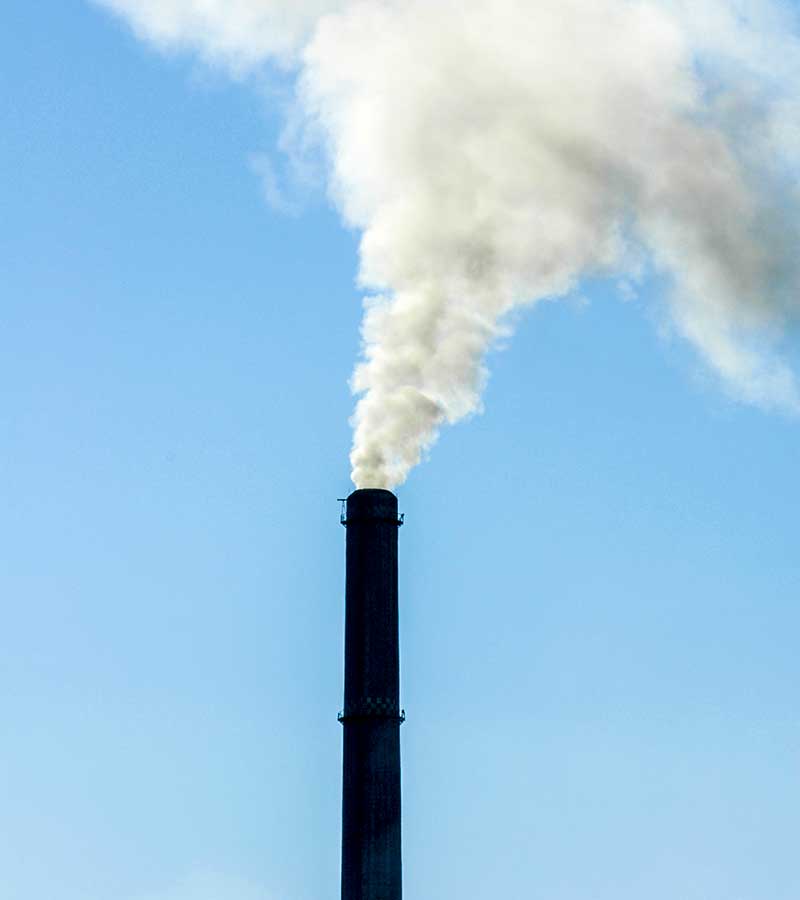 West End News - Smoke stack - Carbon fee and dividend 