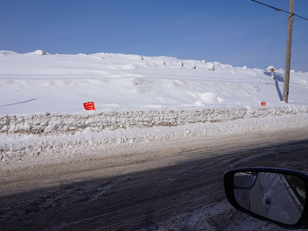 Snow banks along Portland street with "Emergency No Parking" red signs -WEN file