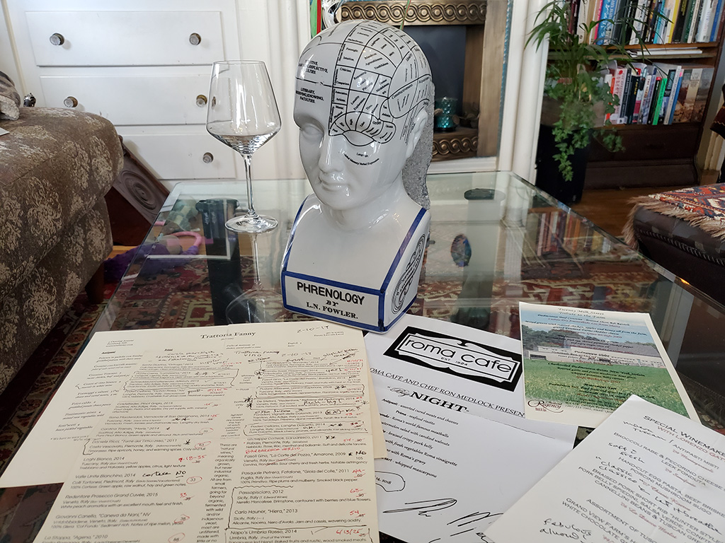 West End News - Layne's Wine Gig - Phrenology head with menus