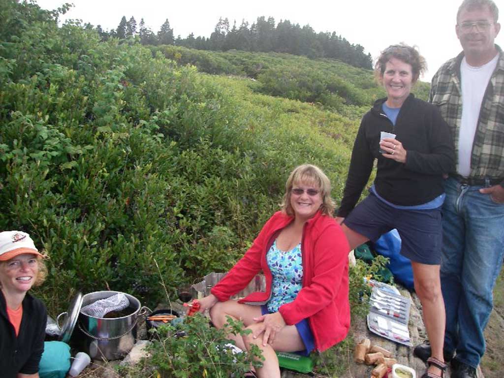 West End News - Nancy, Lynn, Sue, and Bill enjoying summer with a lobster meal on Whaleboat Island