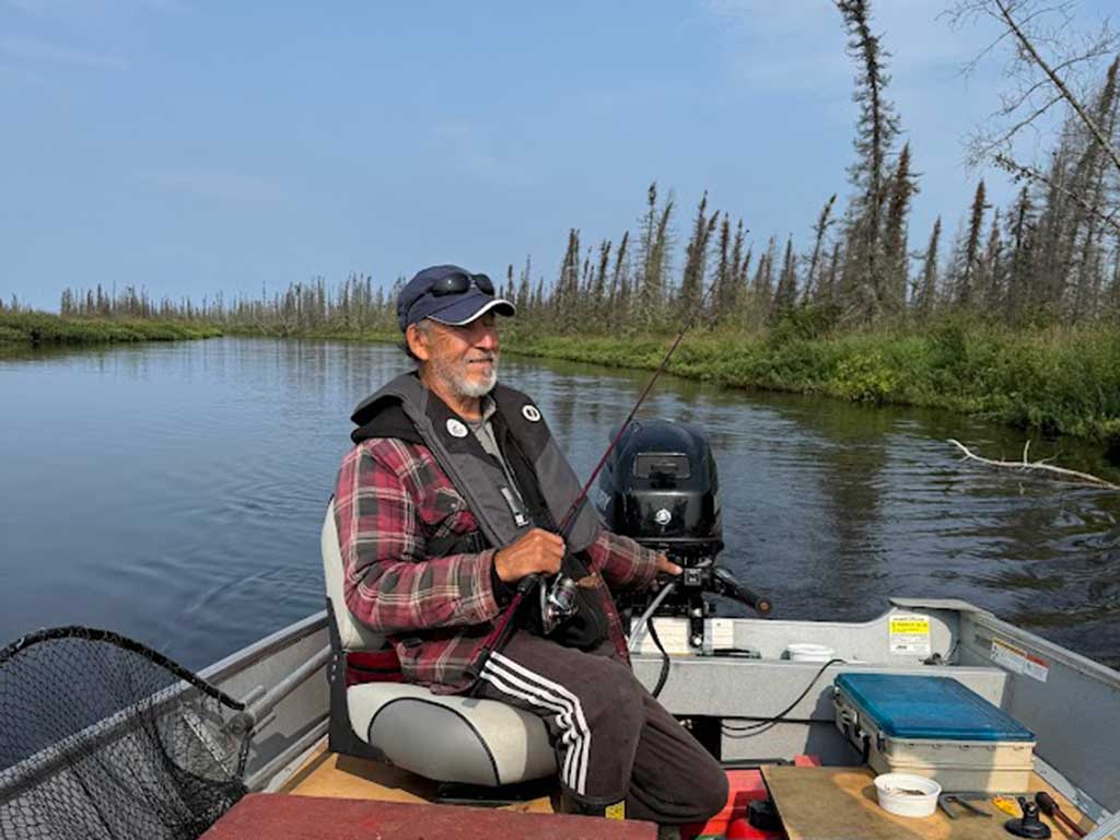 Lloyd Lake Lodge guide Ivan fishing and trolling