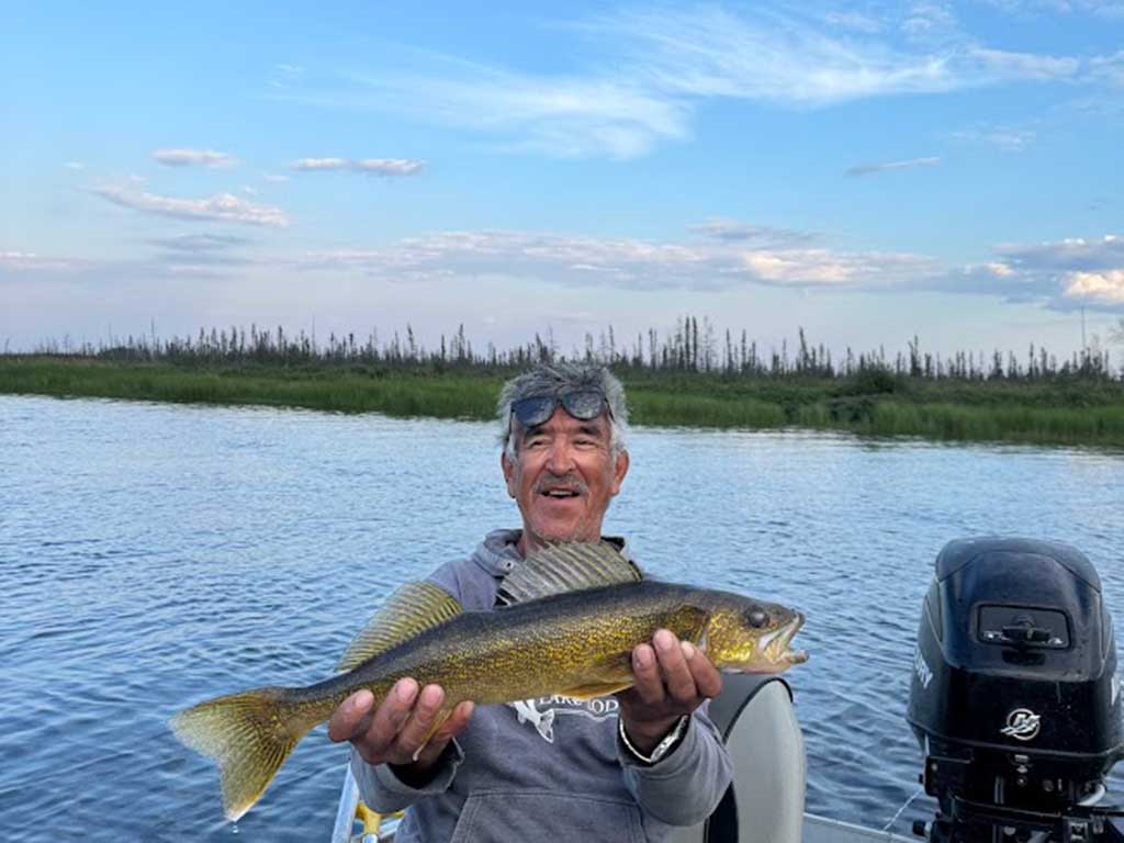 Lloyd Lake Lodge guide Reverse with the walleye Nancy caught