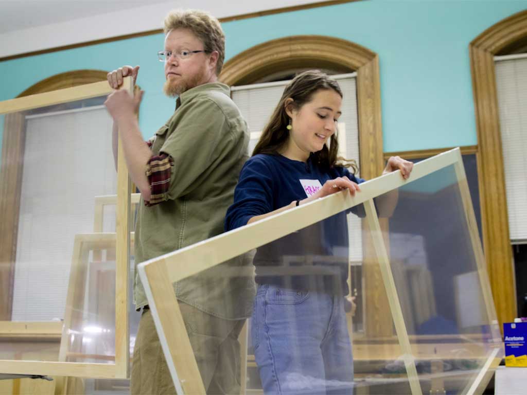 WindowDressers community build volunteers creating reusable windown inserts -Courtesy photo