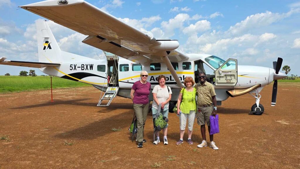 Bush plane at dirt landing strip near Murchison Falls National Park