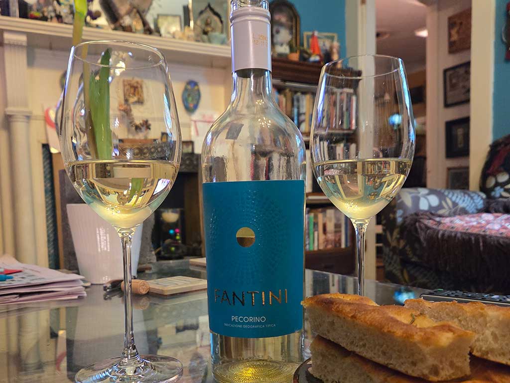 Fantini bottle with wine glasses and bread