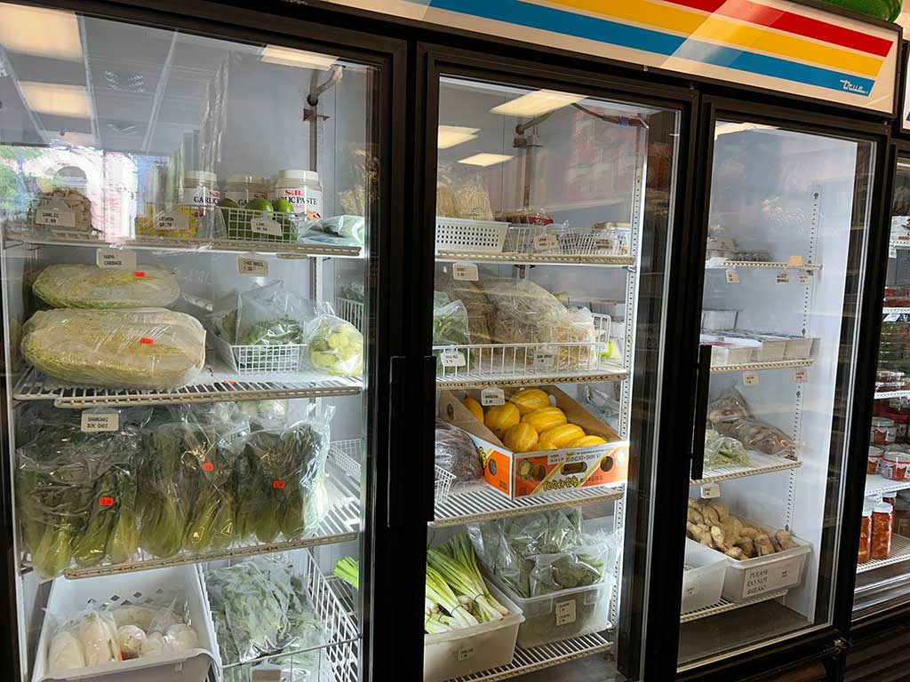 Cooler with fresh produce at Sun Oriental Market