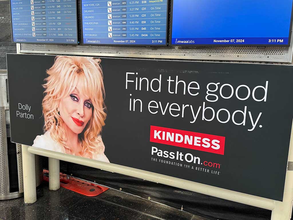 Billboard of Dolly Parton at airport