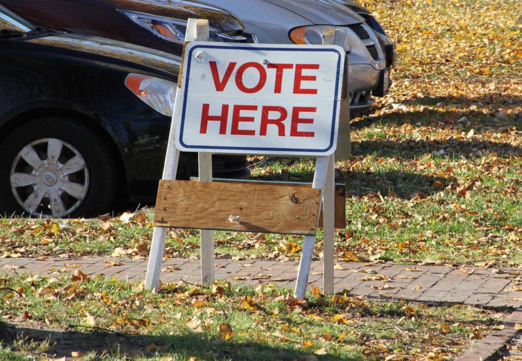 West End News - Vote here sign for how-to vote absentee or in person