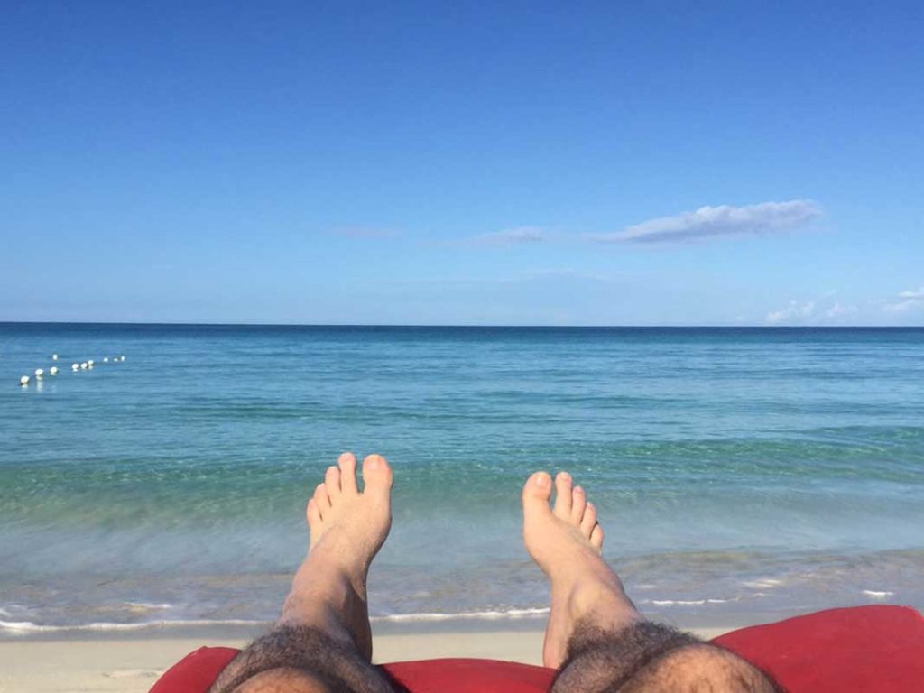 West End News - Sun protection - sun bathing on the beach