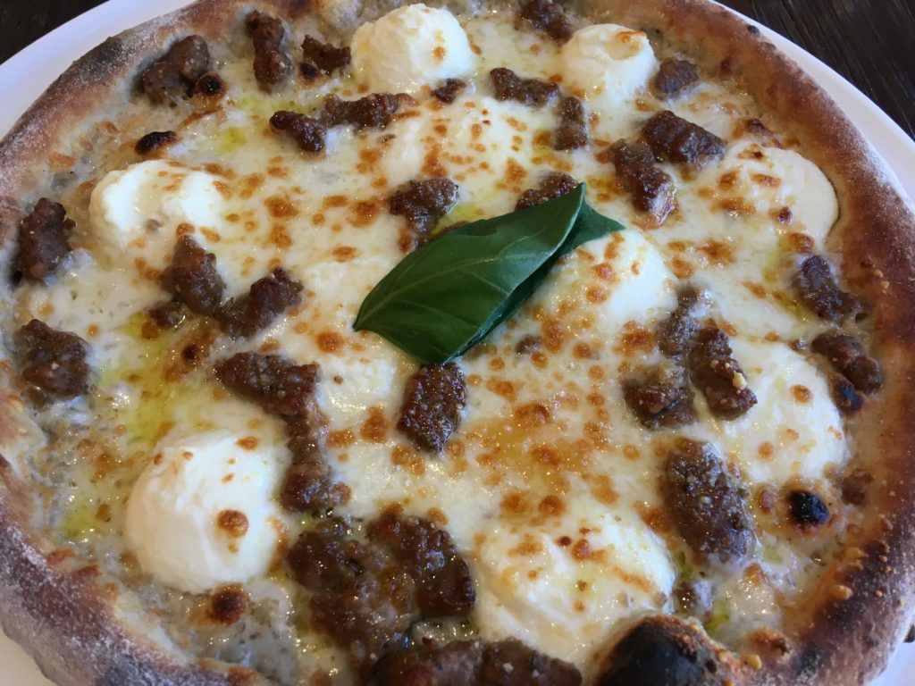 Pizzarino: Bianca Neve whole pie (white pizza with sweet sausage).