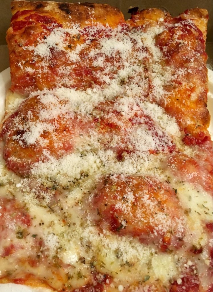 Micucci's: slice of Sicilian style cheese pizza.