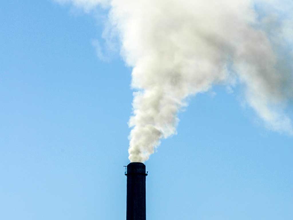 West End News - Stock image of smoke stack at coal power plant for article on racial justice and climate justice