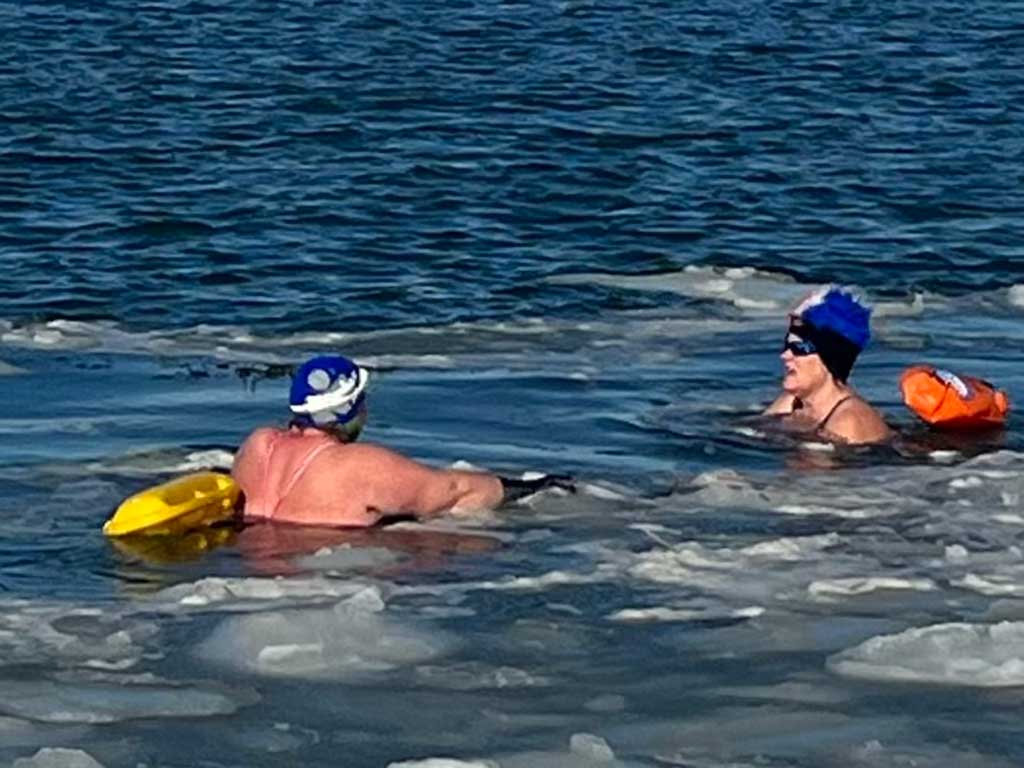 West End News - Ocean swimming in winter - two swimmers in icy waters