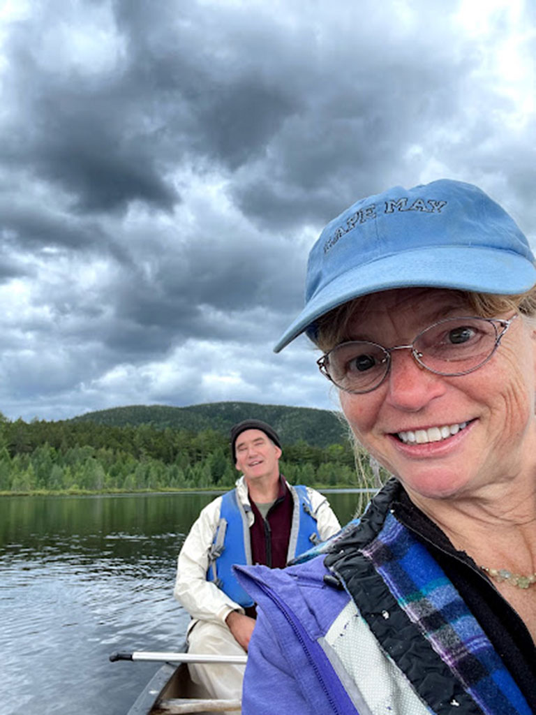 West End News - Nancy with friend in a canoe on Sebec Lake