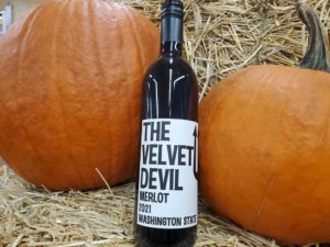 The Velvet Devil wine bottle with pumpkins