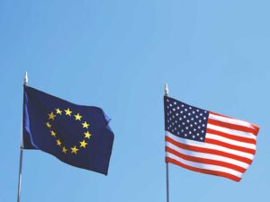Flags of Europe and United States next to each other - for Climate Change: How Europe and AMerica are tackling the issue -By Sofie Dejaegher -Photo by Axel Bueckert / Adobe Stock