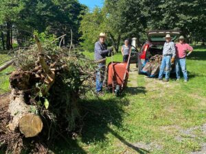 Western Cemetery volunteers piling up brush for city removal