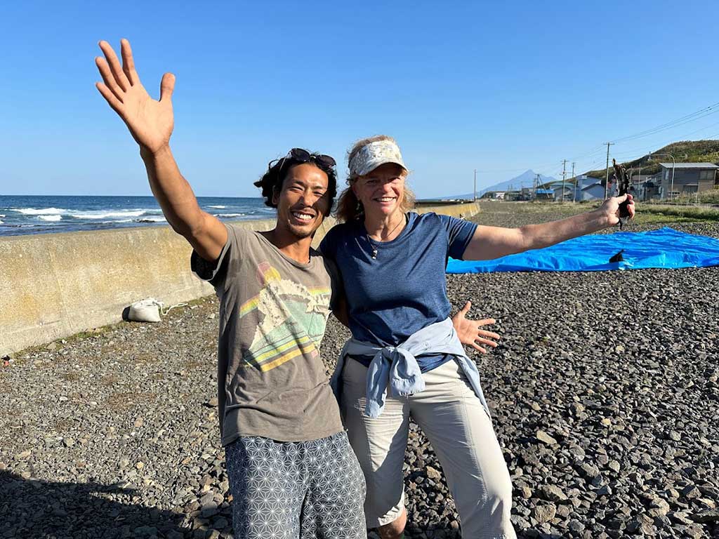 Adventure traveler and travel advisor Nancy Dorrans with seaweed harvester in Hokkaido, Japan
