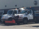 City plow trucks parked at former public works facility downtown