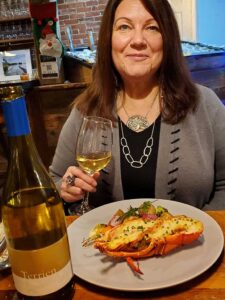 Judy Witherell with Terrien Sonoma Chardonnay and lobster thermidor at Maine Oyster Co.