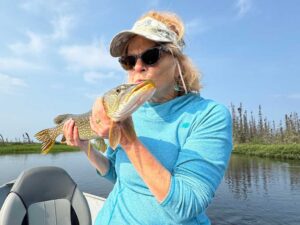 Kiss the fish for luck! Nancy with her sparkling northern pike