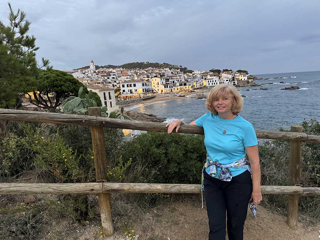 Nancy Dorrans overlooking a small cove along Costa Brava