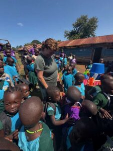 Gifting school supplies at a primary school near Kibale National Park in Western Uganda
